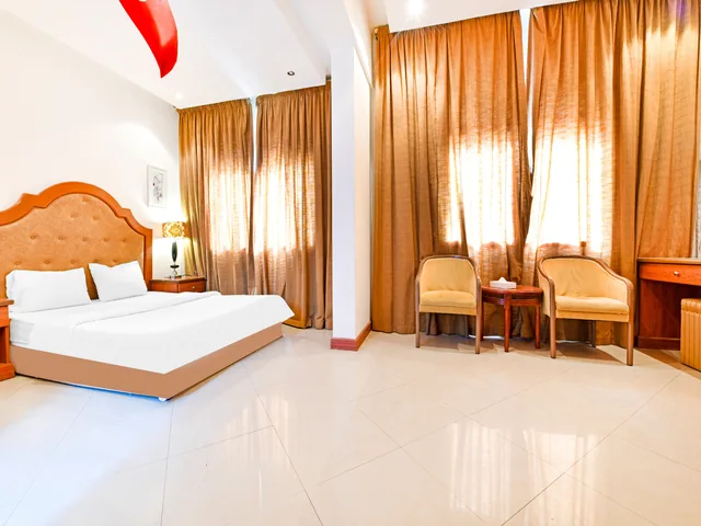 غرفة ديلوكس بسرير كينج، OYO 118 Revira Hotel 1/7