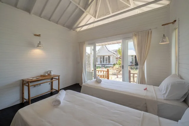 غرفة ديلوكس بسريرين منفصلين بإطلالة على الحديقة، Paus Putih Hotel Lembongan 1/4