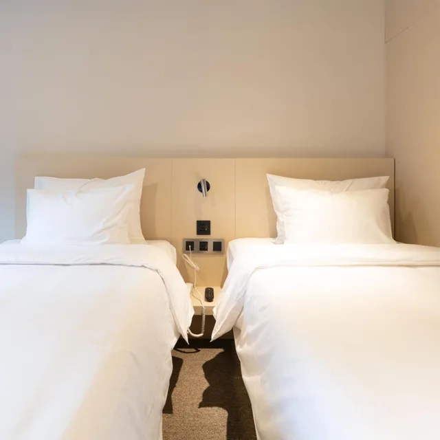 غرفة بسريرين منفصلين بحوض استحمام، Hotel Myeongdongjang 3/5