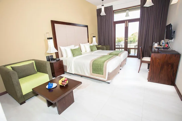 Room, 1 Double and 1 Single Bed, Lagoon View, Amora Lagoon 1/2