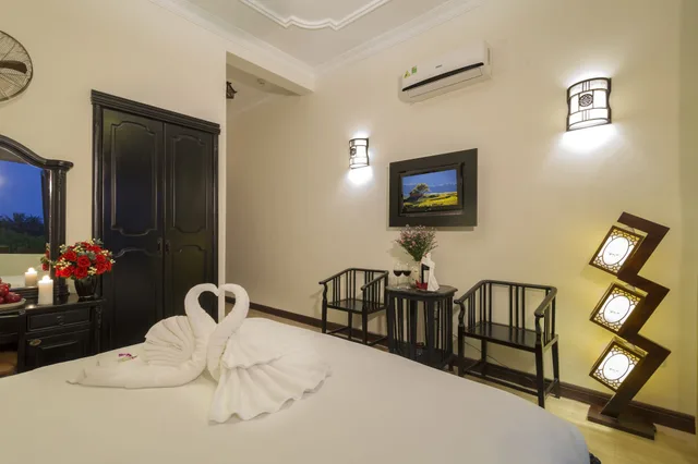 غرفة ديلوكس بسرير كينج، Nesta Hoi An Resort and Spa 3/9