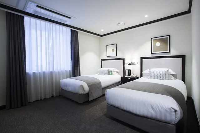 غرفة ديلوكس بسريرين منفصلين، The Grand Hotel Myeongdong 4/5
