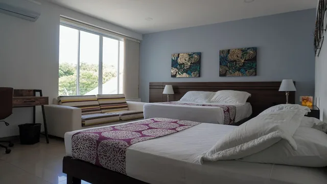 غرفة قياسية بسريرين منفصلين وسرير كوين، Malik Hotel Boutique 1/10