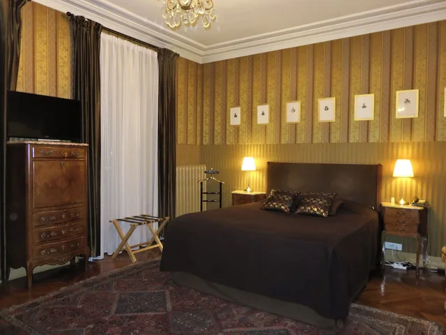 غرفة ديلوكس رباعية بسرير كينج وسرير فردي مع أريكة، Hotel Windsor Home Paris 1/8
