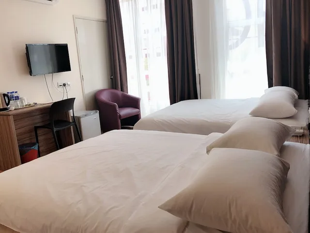 غرفة ديلوكس رباعية بسريرين كوين، Tumike Hotel 3/3