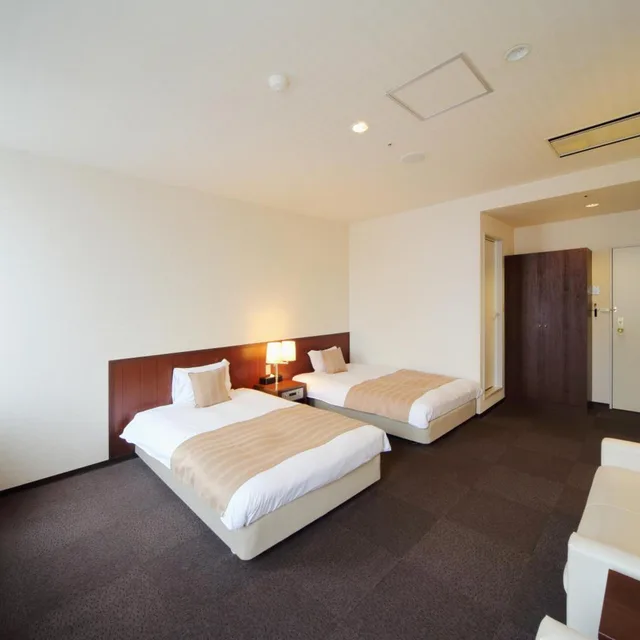 غرفة كبيرة بسريرين منفصلين، Asahikawa Toyo Hotel 1/10