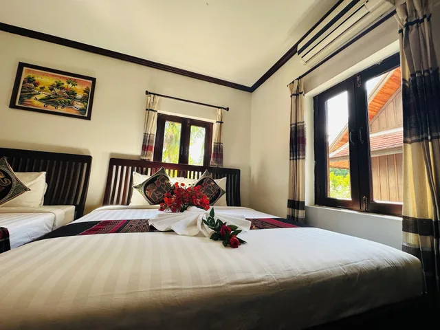 غرفة ديلوكس ثلاثية بسرير كينج وسرير فردي، Thatsaphone Hotel 3/9