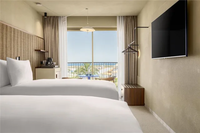 غرفة بسريرين منفصلين بإطلالة على البحر، Amarello Hotel Praia Santo Andre, Tapestry Collection by Hilton 4/5