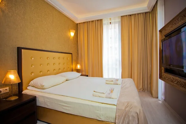 شقة ديلوكس بسريرين كوين بغرفتي نوم مع أريكة، Harmony Suites 2 3 1/4