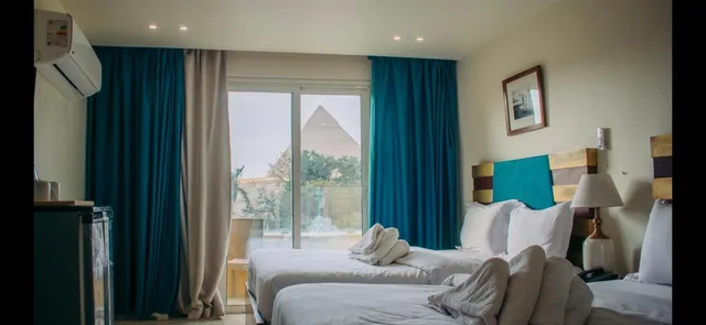 غرفة رباعية بسريرين كوين بشرفة، Great Pyramid Inn 1/4