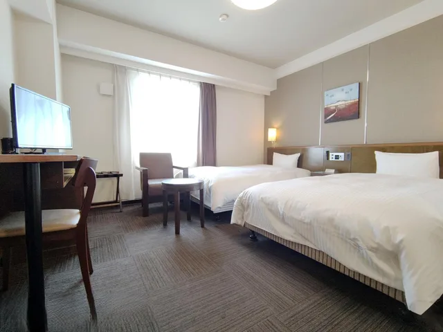 غرفة بسريرين منفصلين، Hotel Route-Inn Iwakiizumi Ekimae 1/2