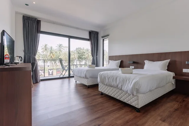 غرفة ديلوكس ركنية بسريرين منفصلين، Roxy Sematan Villa And Townhouse 2/4