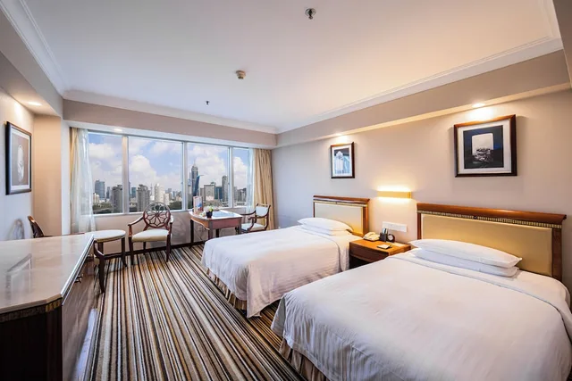 غرفة ديلوكس بسريرين منفصلين، Jin Jiang Tower Hotel 1/5