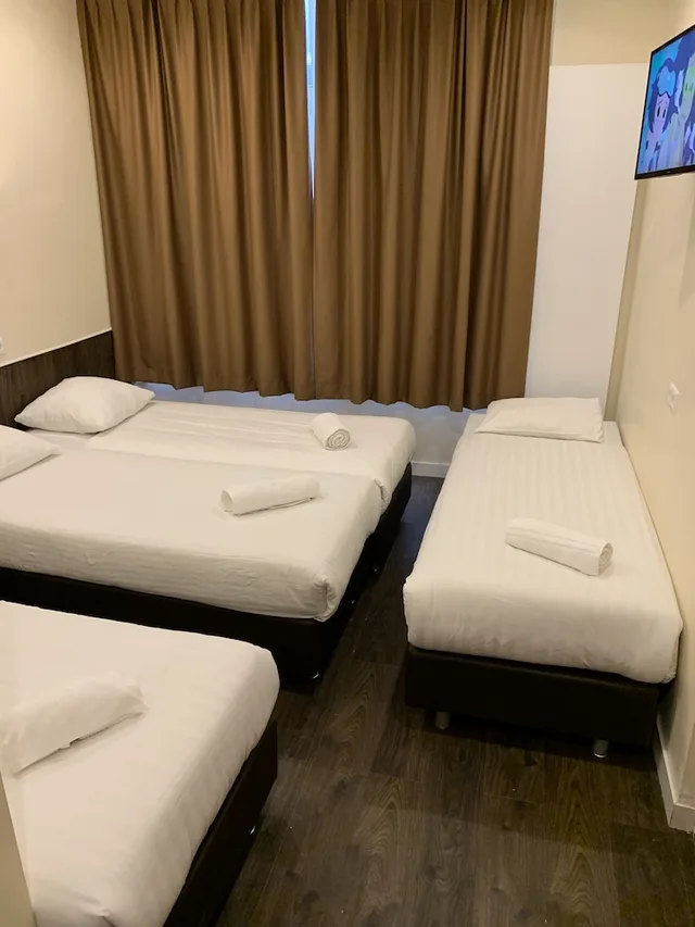 غرفة أساسية رباعية بأربعة أسرّة بحمام خاص، Orange Tulip Hotel 2/5