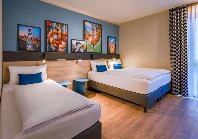 غرفة ديلوكس ثلاثية بسرير فردي وثلاثة أسرّة، Ramada Encore by Wyndham Munich Messe 1/10