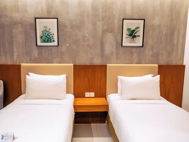 غرفة ديلوكس بسريرين منفصلين بإطلالة على الحديقة، Kambaniru Beach Hotel and Resort 1/6