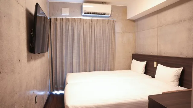 Room, Twin Beds, New Wing, The Breakfast Hotel Porto Ishigaki 3/3
