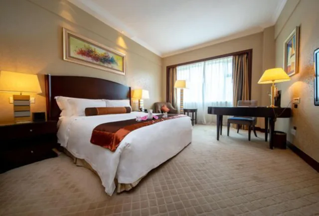 Deluxe King Size Bed Room H، GRAND INTERNATIONAL HOTEL 1/10