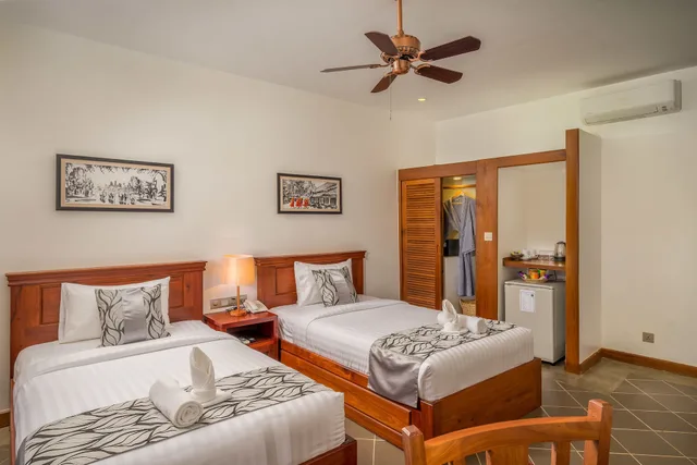 غرفة ديلوكس بسريرين منفصلين بإطلالة على المسبح بشرفة، Savada Angkor Boutique Hotel 2/5