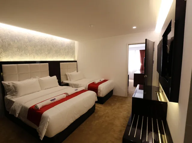 غرفة ديلوكس ثلاثية بسرير كوين وسرير فردي، Wiwo Hotel 1/3