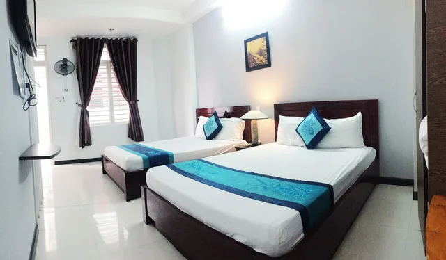 غرفة عائلية رباعية بسريرين مزدوجين بإطلالة على الحديقة للمدخنين، QUAN QUAN HOTEL 1/6