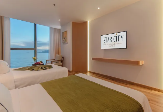 غرفة متصلة عائلية بسرير كينج وسريرين منفصلين بإطلالة على البحر، Starcity Bayfront Nha Trang Hotel 9/10