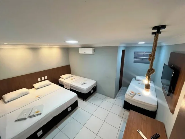 غرفة قياسية رباعية بسرير كوين وسريرين منفصلين، Hotel Luar De Itapua 3/9