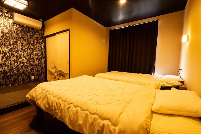 غرفة يابانية ثلاثية بفراش فوتون وسريرين منفصلين بحمام مشترك، Guest House Ouka - Hostel 4/6