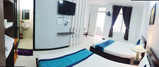 غرفة عائلية رباعية بسريرين مزدوجين بإطلالة على الحديقة للمدخنين، QUAN QUAN HOTEL 6/6