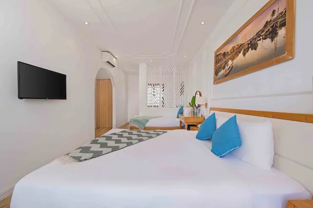 غرفة رباعية بسرير كينج وسريرين منفصلين، Lime Villa Hoi An 3/4