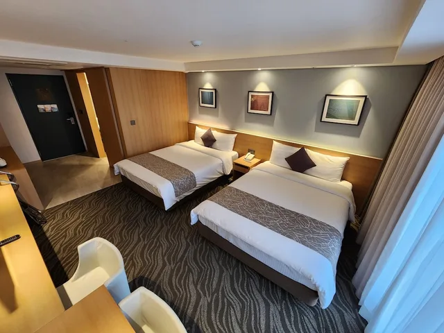 غرفة عائلية رباعية بسريرين مزدوجين بإطلالة على المدينة بشرفة، Seogwipo JS Hotel 1/6