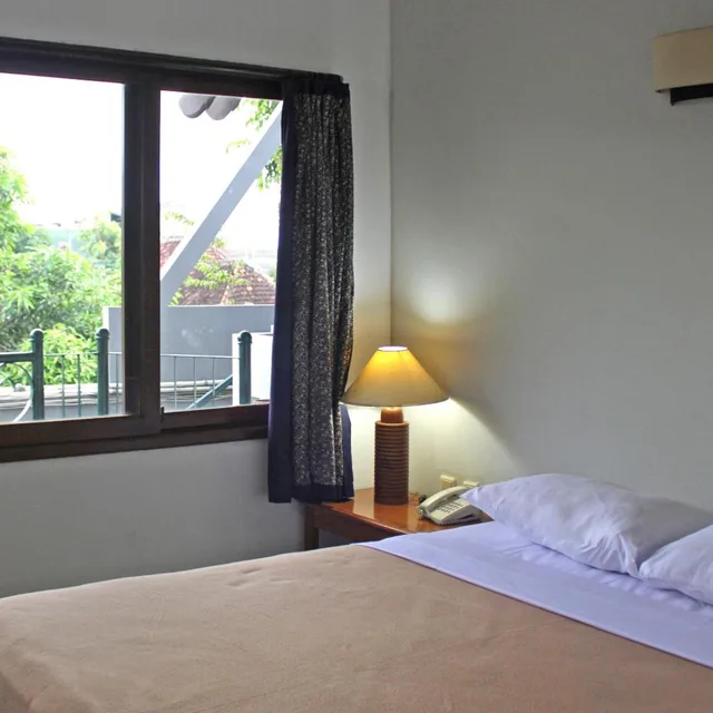 غرفة بسرير مزدوج بشرفة، Hotel Winotosastro Garden 6/8