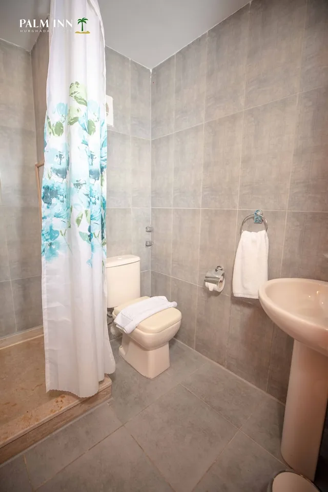 غرفة مفردة بسرير كوين، Palm Inn Hotel 9/9