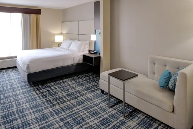 Suite, King Bed, Living and Dining Areas, Holliday Inn Belcamp Aberdeen Area Ex Wingate By Wyndham Aberdeen Edgewood 2/10