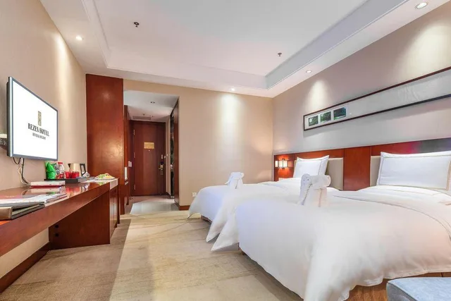 غرفة سوبيريور بسريرين منفصلين، River & Holiday Rezen Hotel DaoZhen 1/1