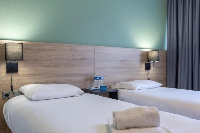 غرفة بسريرين منفصلين، Comfort Aparthotel Le Mans 3/6