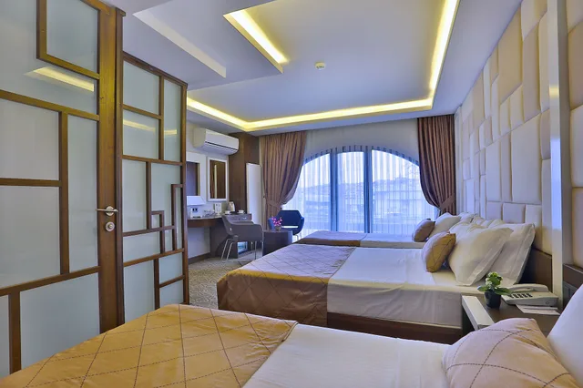 غرفة رباعية بسرير مزدوج وسريرين منفصلين، Grand Sagcanlar Hotel 2/9