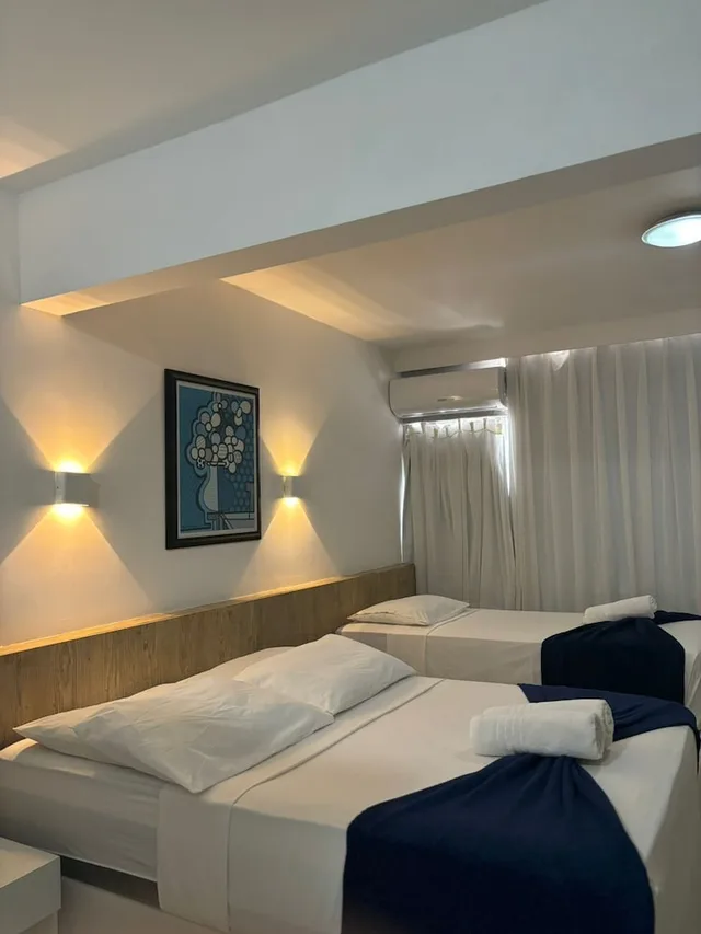 غرفة قياسية بسرير مزدوج وسرير فردي، Praia Hotel Enseada 1/2