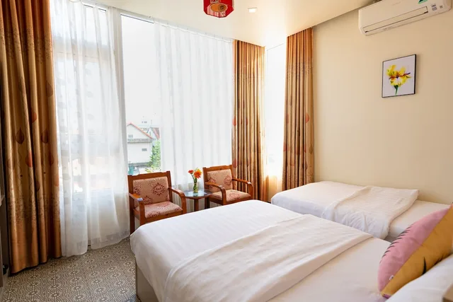 غرفة عائلية بسرير كينج وسرير فردي بإطلالة على الحديقة، Flora Hotel Hue 6/10