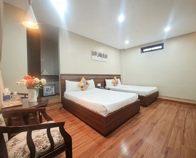 غرفة عائلية رباعية بسريرين مزدوجين بإطلالة على الحديقة للمدخنين، QUAN QUAN HOTEL 5/6