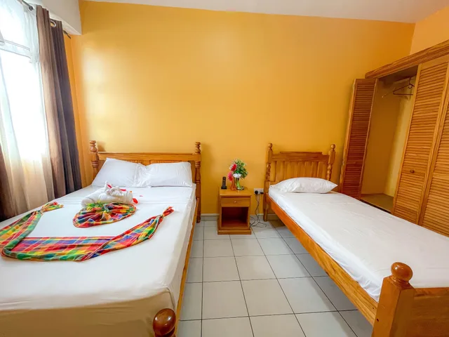 غرفة قياسية بسرير مزدوج وسرير فردي، La Flamboyant Hotel 1/10