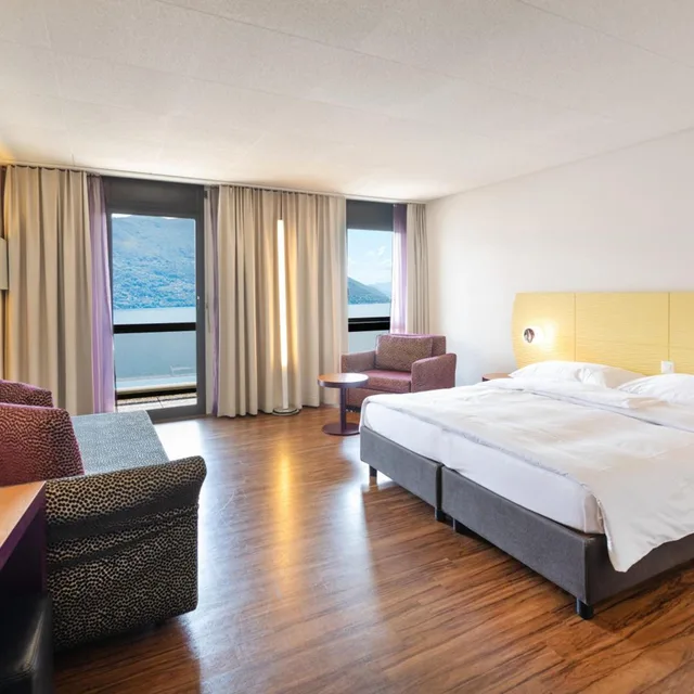غرفة كومفورت كبيرة بسرير فردي بإطلالة على البحيرة، Parkhotel Brenscino 1/3