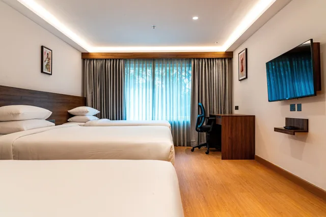 غرفة عائلية ثلاثية بسرير كوين وسريرين منفصلين، Lilac Hotel, Guruvayur 1/3