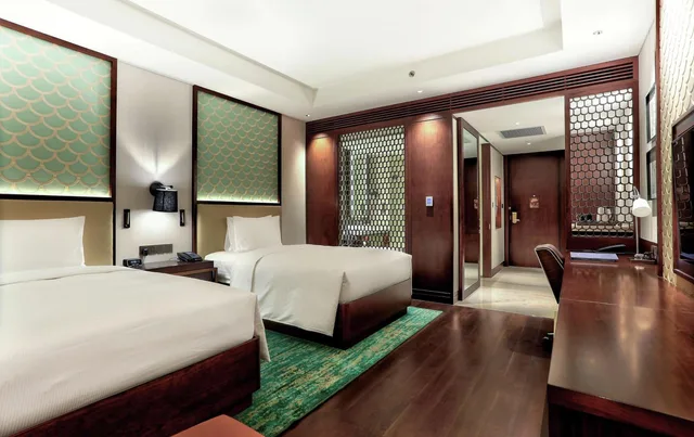 غرفة بسريرين كوين بإطلالة على النهر، Hilton Da Nang 4/7