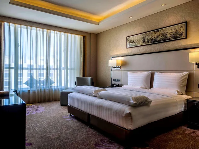 جناح تنفيذي بسرير كينج، Pullman Qingdao Ziyue 2/3
