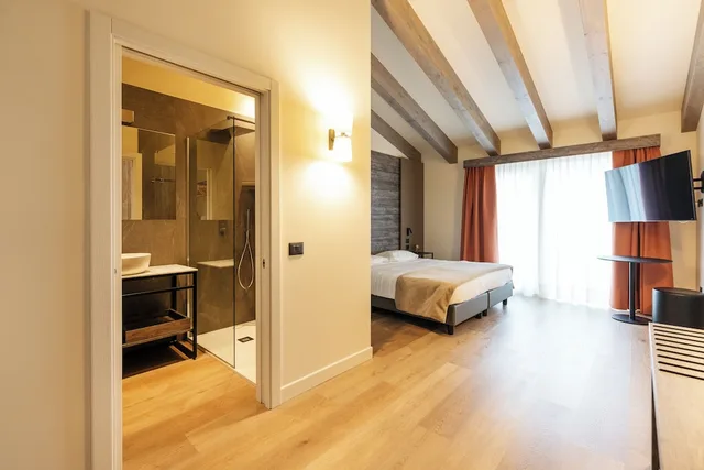 جناح جونيور بسرير مزدوج وسرير فردي، Hotel Delle Alpi 1/1