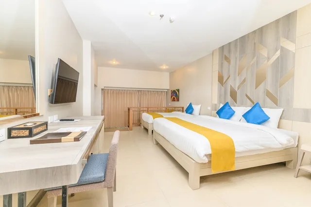 غرفة ديلوكس ثلاثية بسرير مزدوج وسرير فردي، Andakira Hotel 1/2