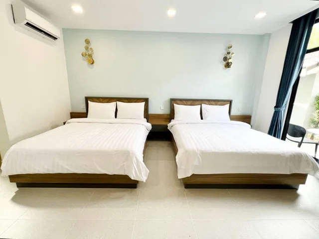 غرفة بسريرين منفصلين بإطلالة على المسبح، Sandy Clay Bungalows 1/3