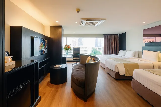 جناح عائلي بسريرين منفصلين وسرير كينج، Golden Tulip Mandison Suites 1/3