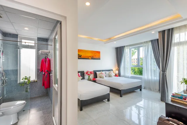 غرفة ثلاثية بسرير مزدوج وسرير فردي بشرفة، Flamingo Villa Hoi An 10/10
